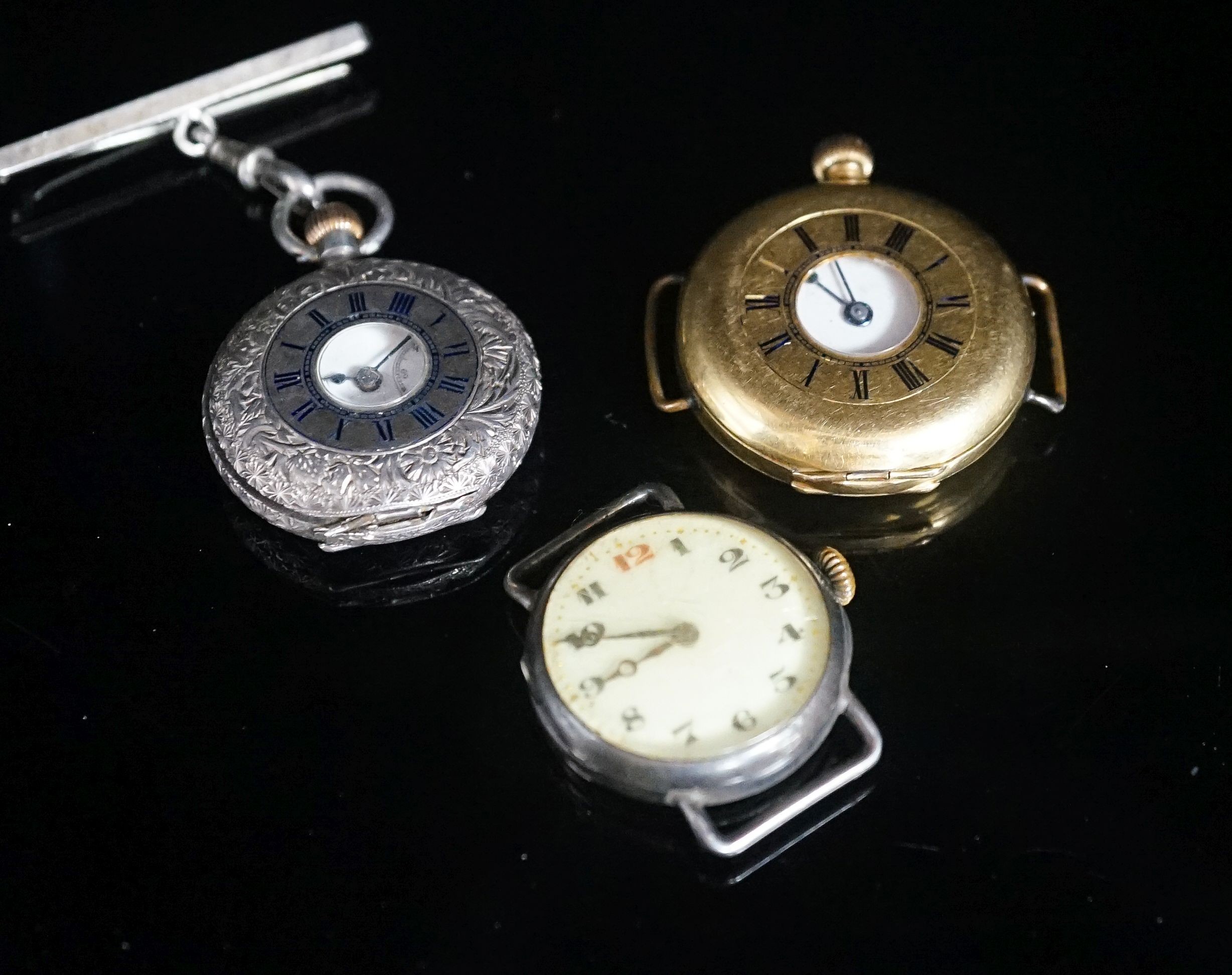 A gentleman's early 20th century continental 18k half hunter wrist watch, case diameter 33mm, gross weight 32.7 grams, together with two other silver watches.